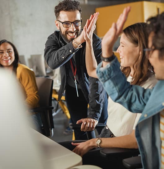 Team happy after making improvements to their Adobe DXP