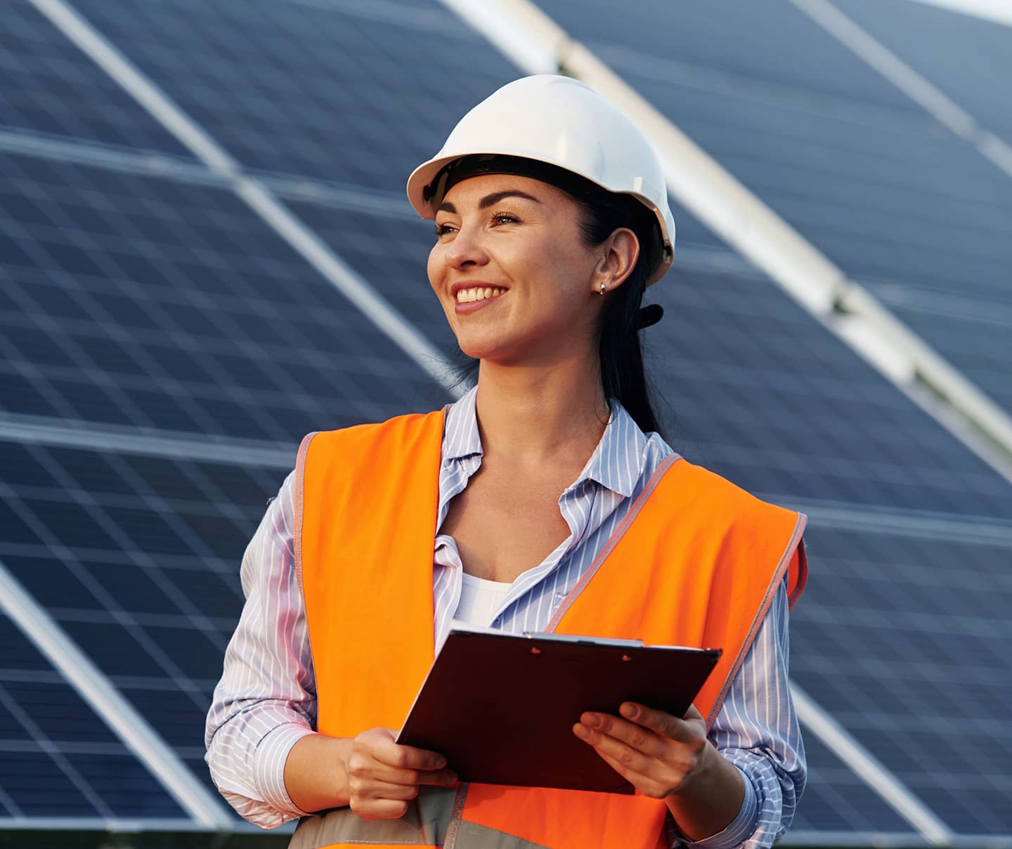 Woman holding a notepad in a Solar energy plant