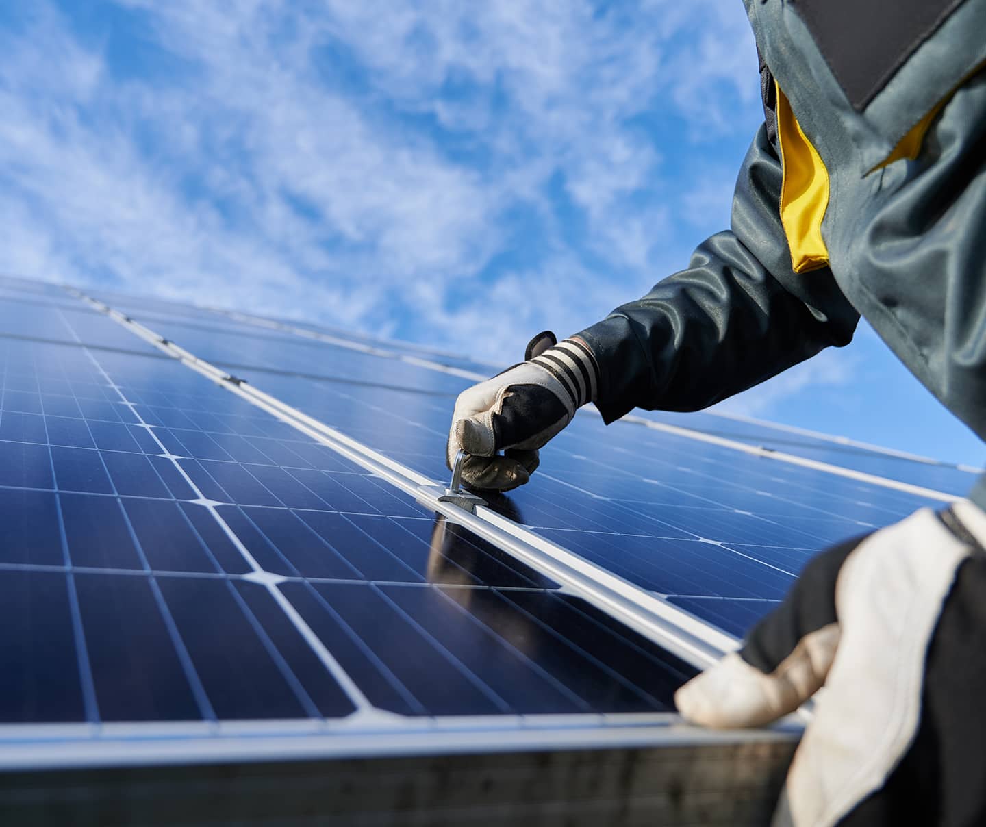 Man working on solar panels