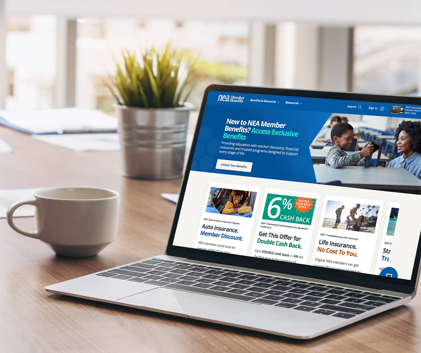 Laptop screen with NEAMB website displaying