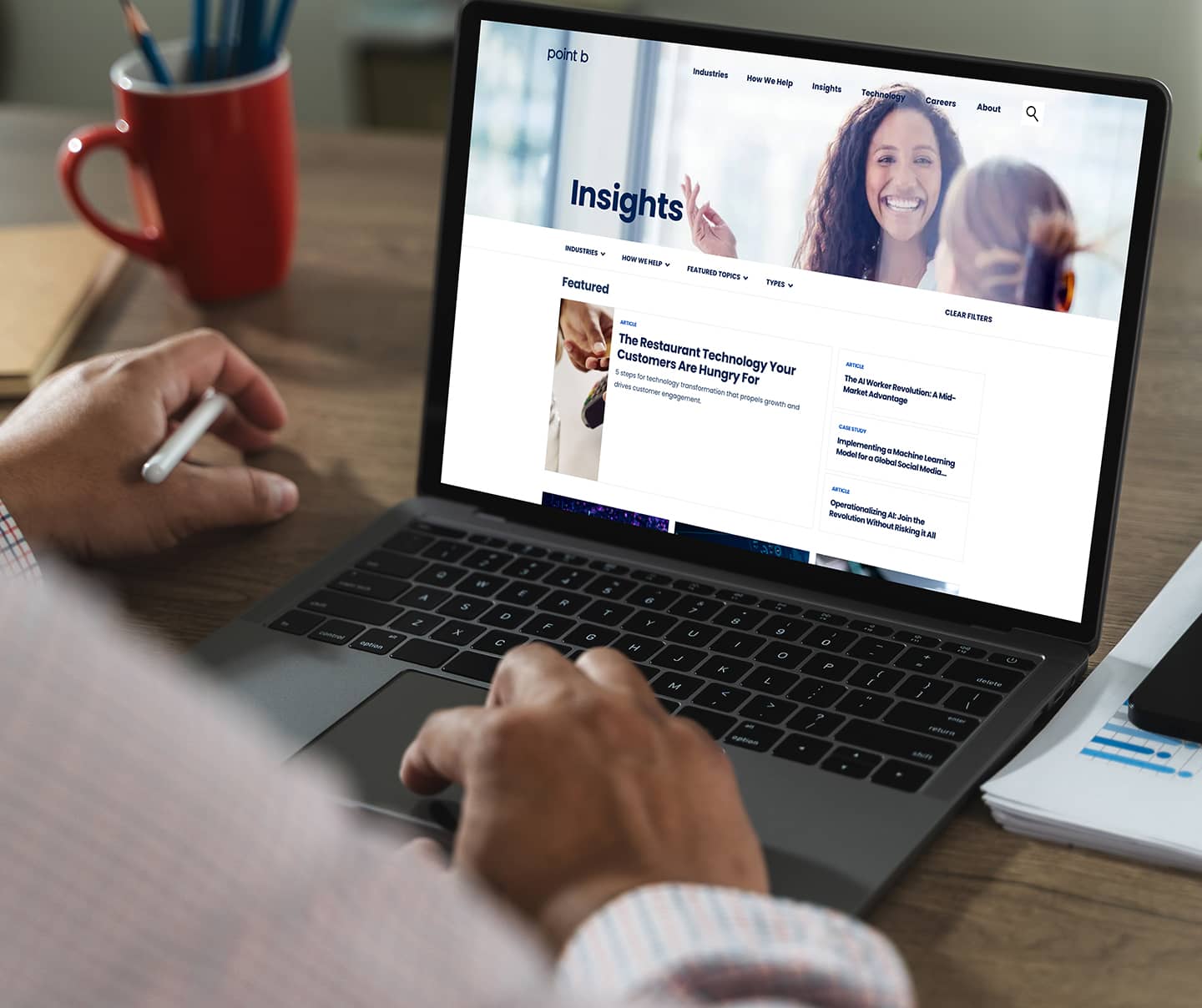 Computer screen with Point B website displaying