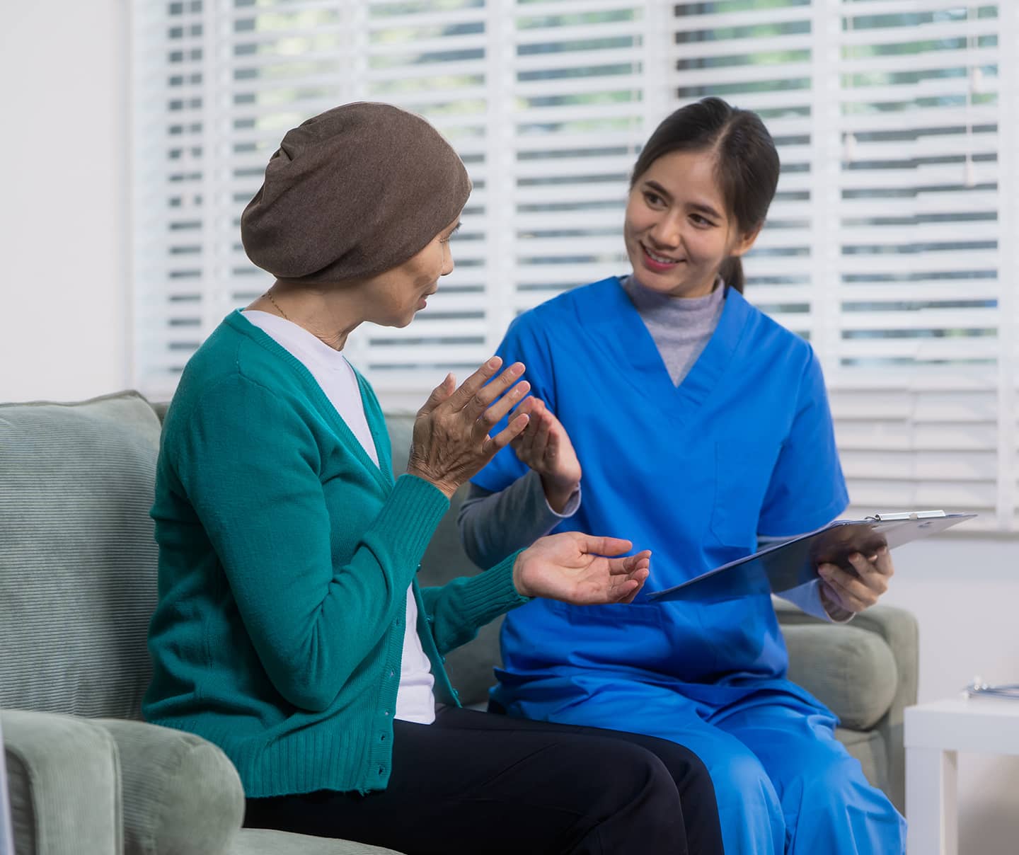 Nurse holding a patient's hands