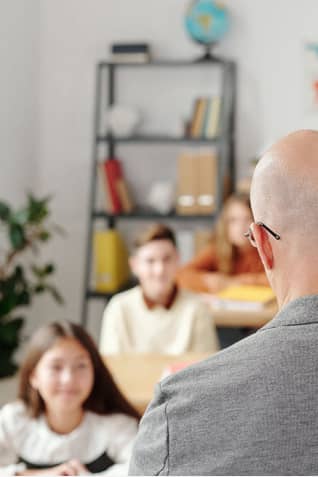 Teacher in front of a classroom - CTAMB Case Study