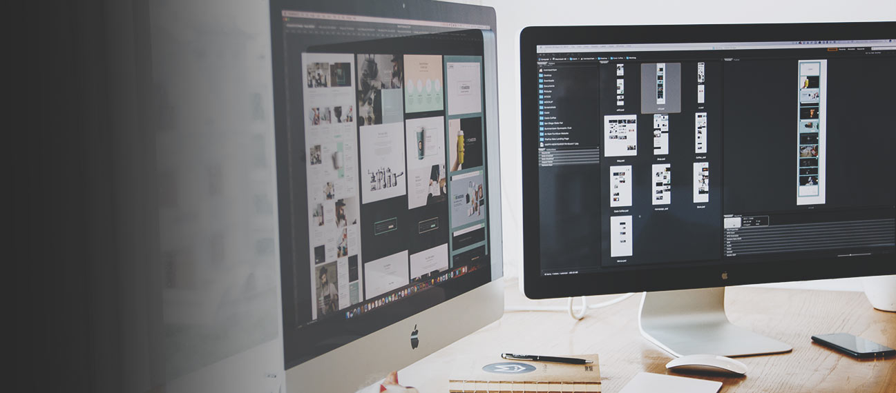 computer monitors with website designs on screens