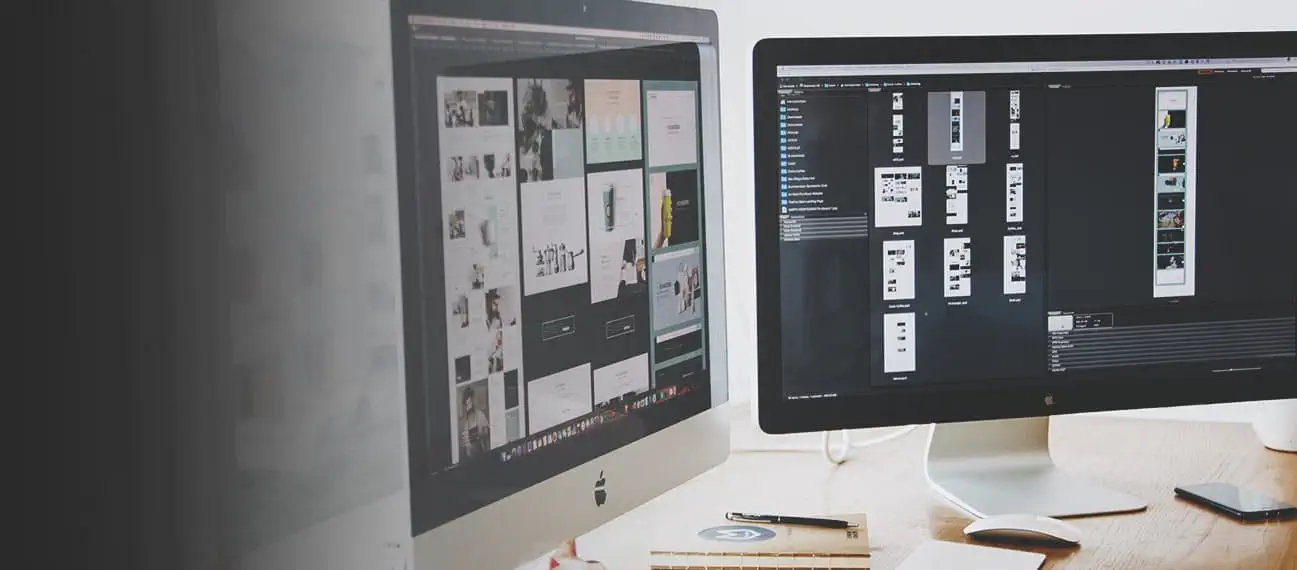 computer monitors with website designs on screens