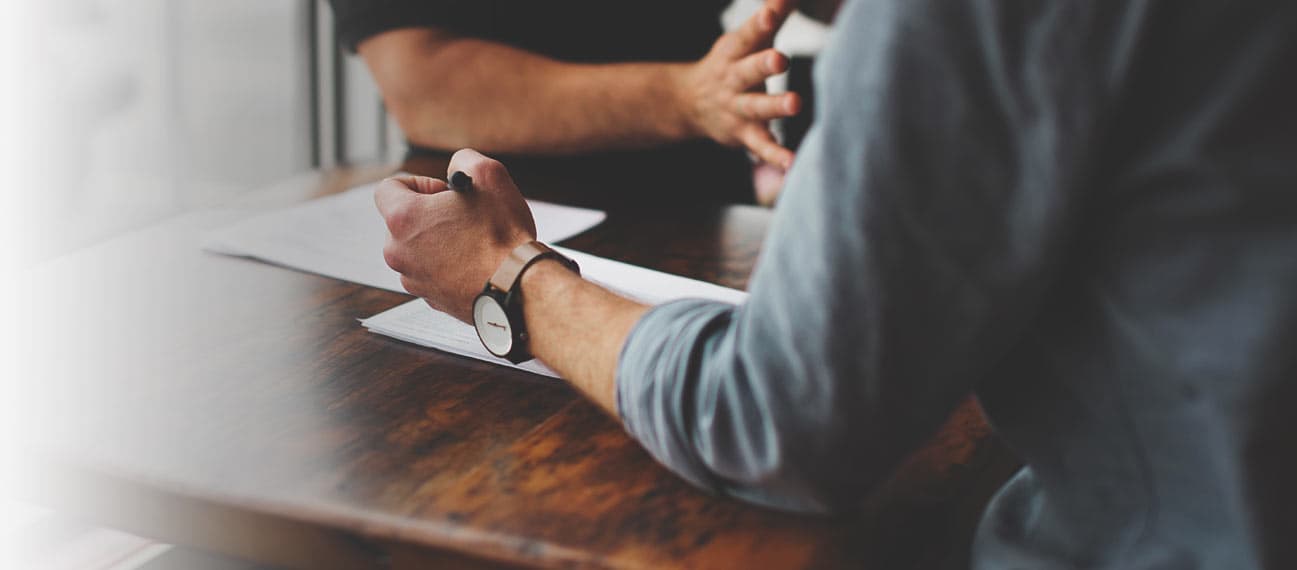 people collaborating at a desk