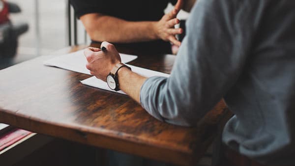 people collaborating at a desk
