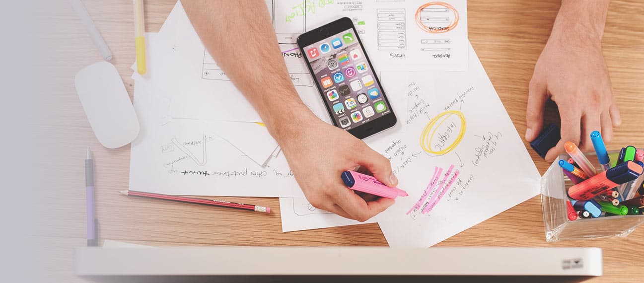 marketer planning and writing on papers