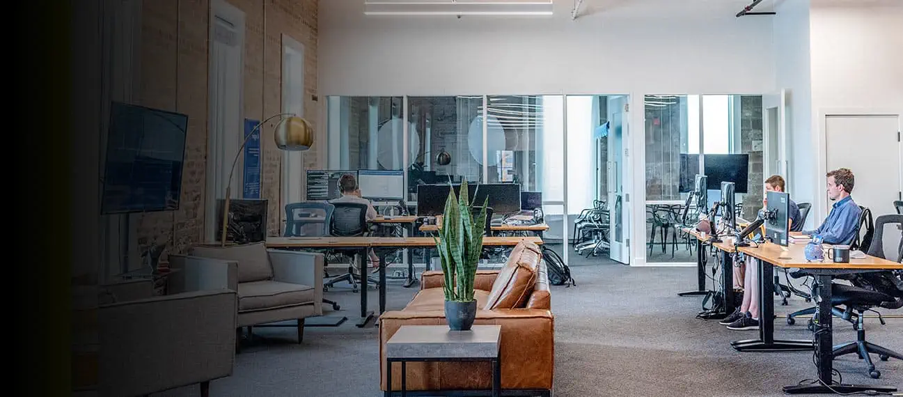 Modern open office with workers using computers