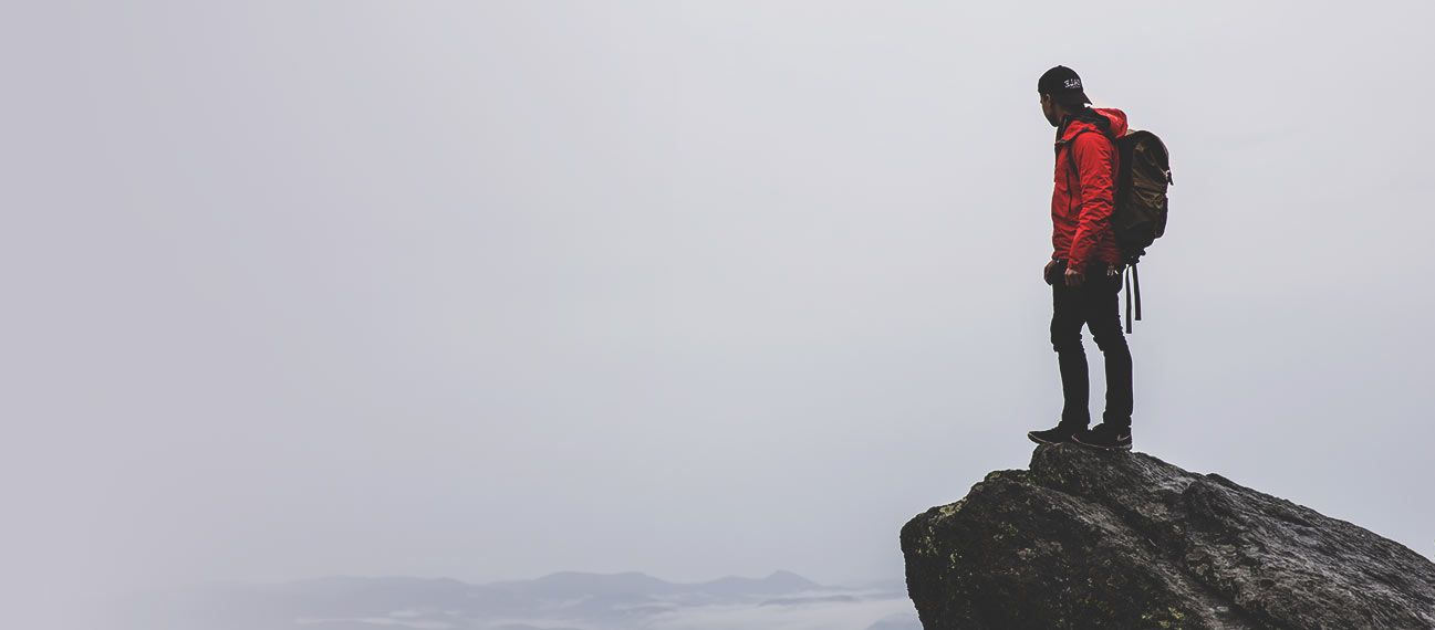 lead mountain climber at summit