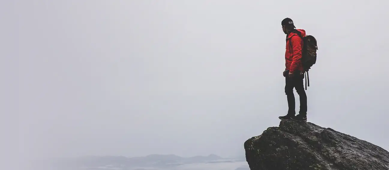 lead mountain climber at summit