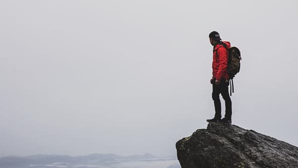 lead mountain climber at summit
