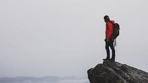 lead mountain climber at summit