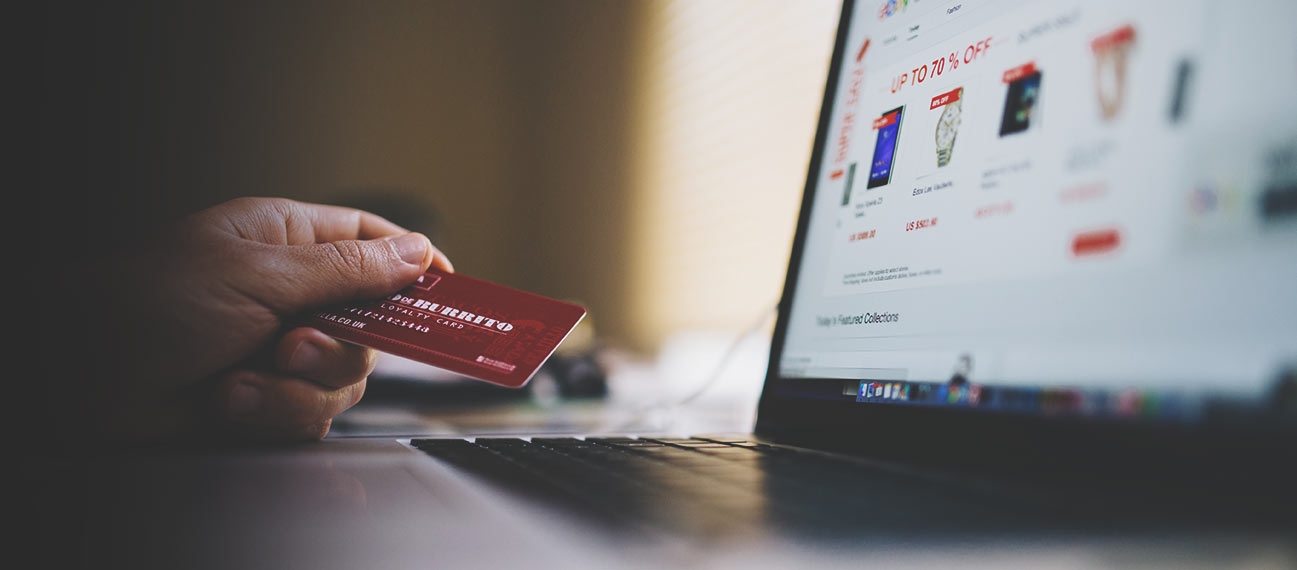 Photo of person using their credit card an an e-commerce website