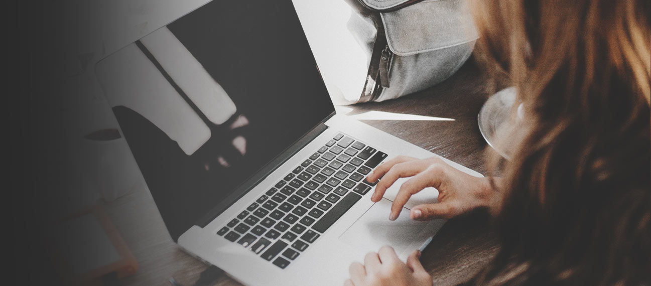 woman typing on laptop