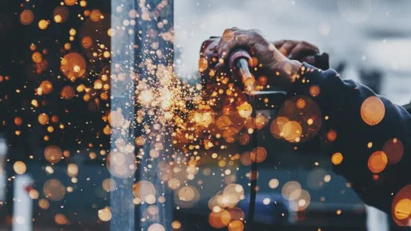 machine worker using heavy tools