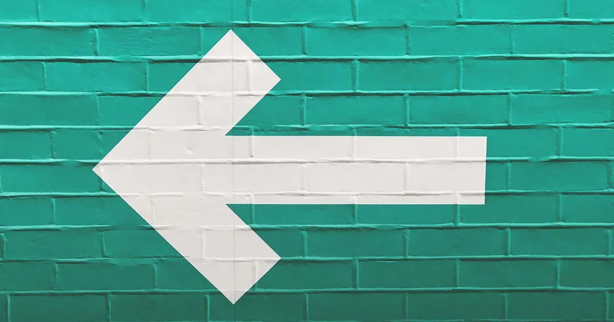 left arrow painted on wall