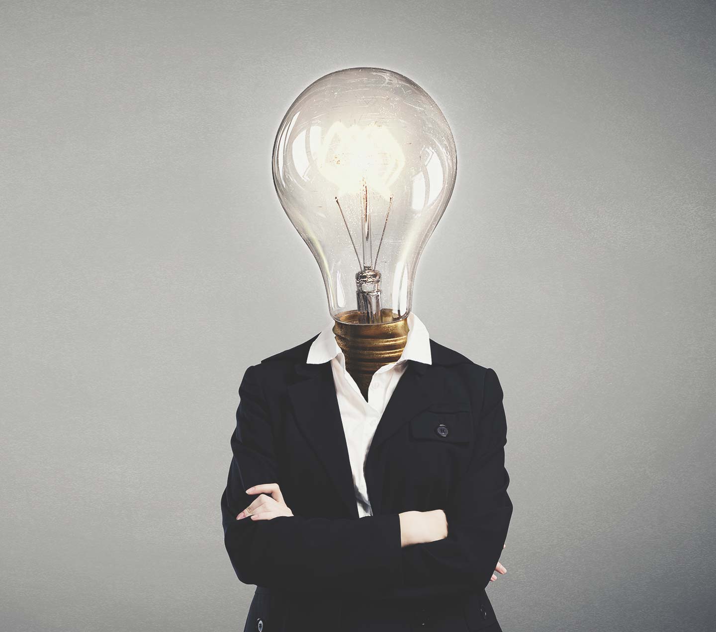 Professional woman with a lightbulb for a head
