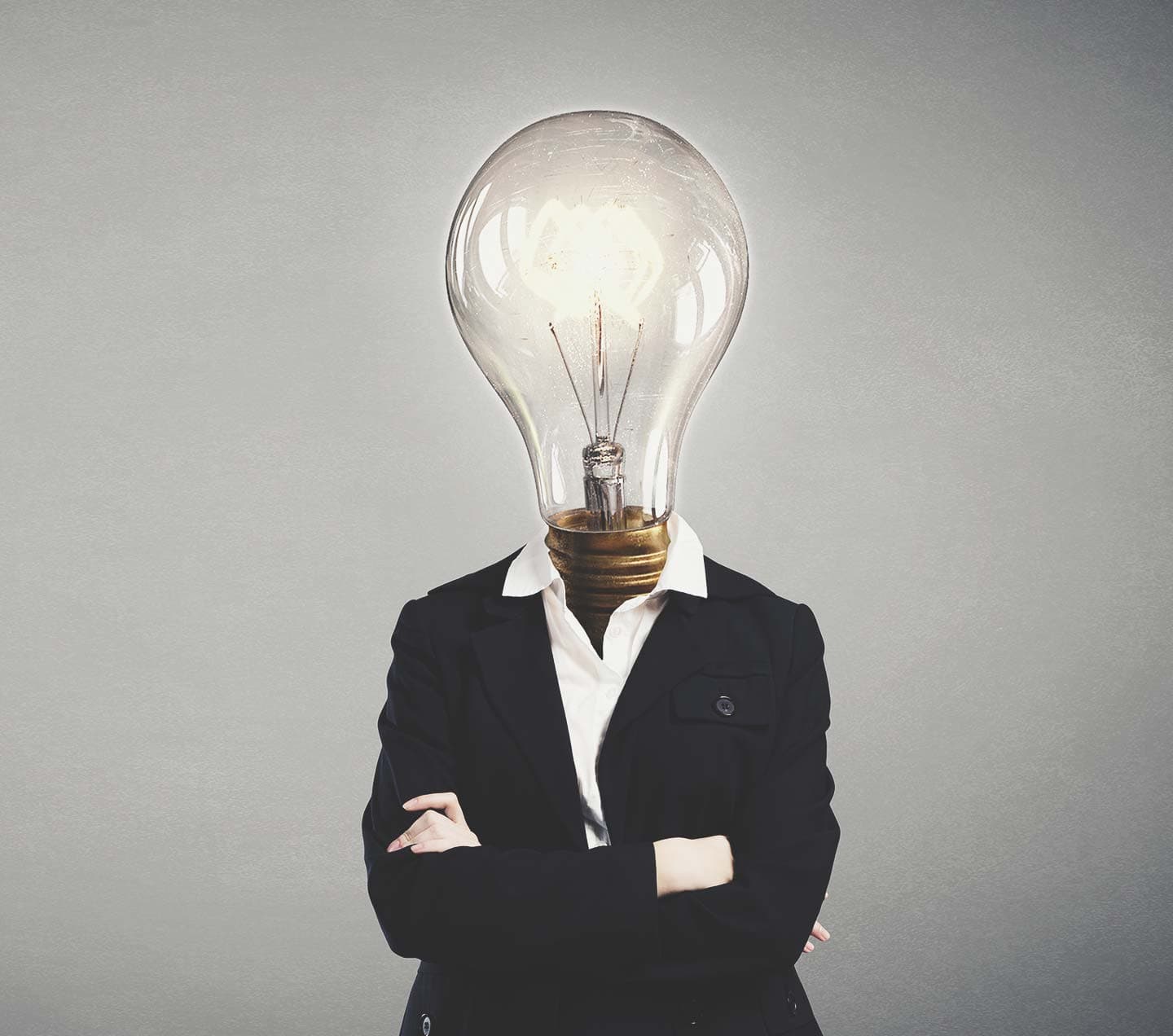 Professional woman with a lightbulb for a head