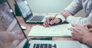 Two men auditing a website