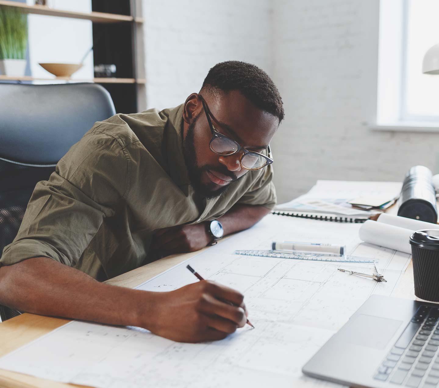 Man at a desk architecting his Sitecore solution