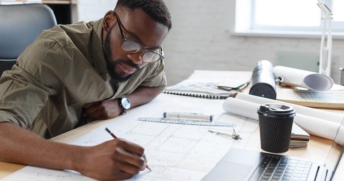Man at a desk architecting his Sitecore solution