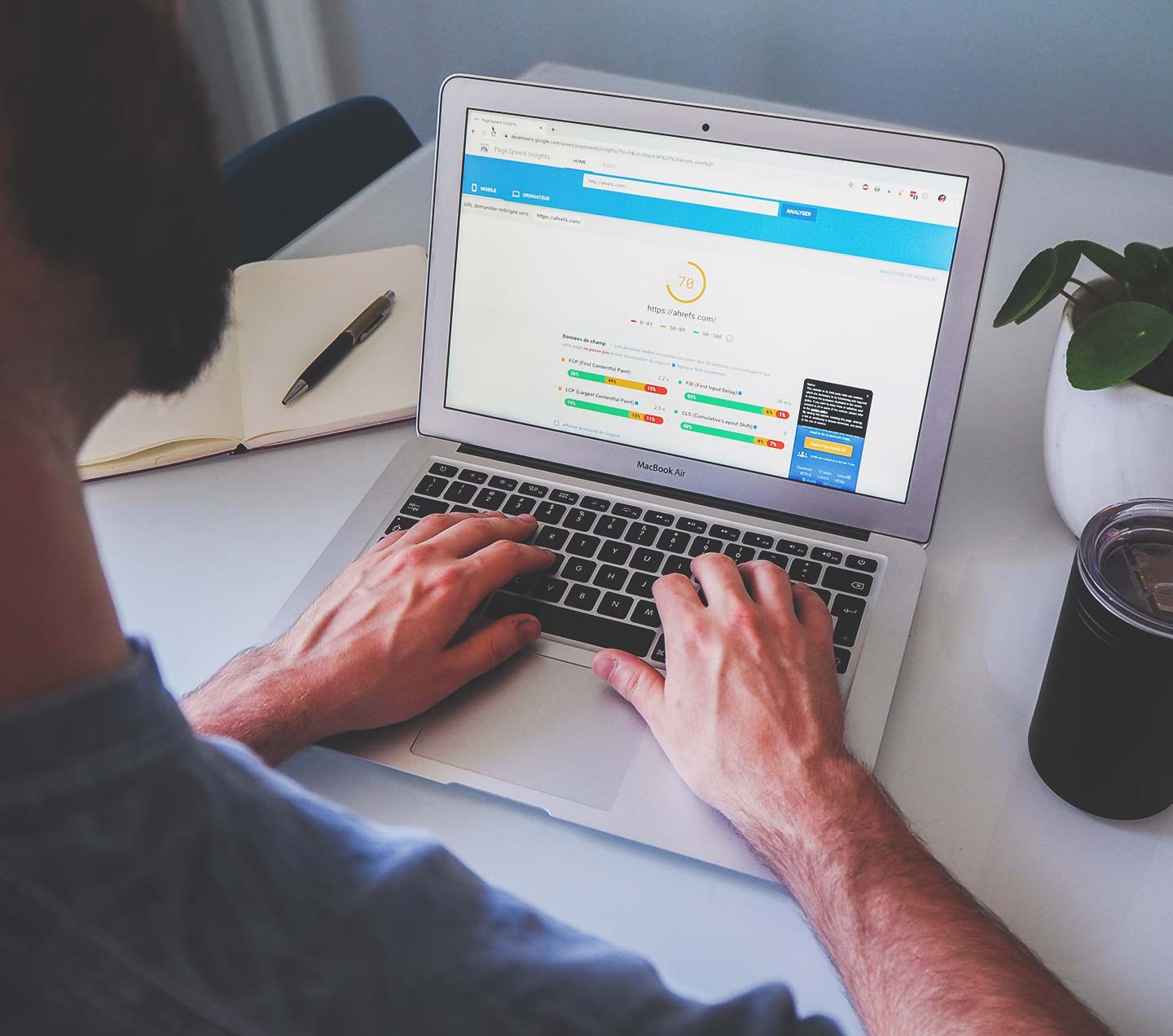 Man on laptop managing his SEO with Sitecore