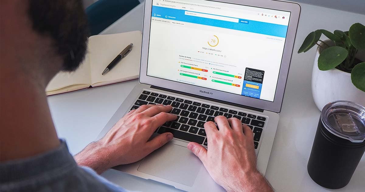 Man on laptop managing his SEO with Sitecore