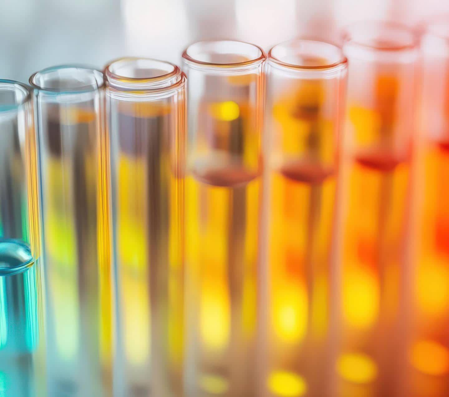 Close-up of colorful test tubes representing experimentation