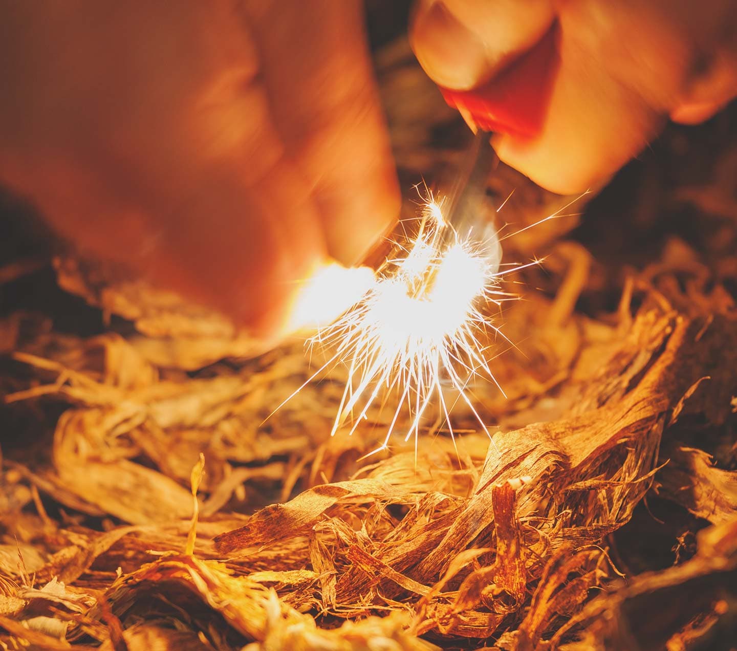 Person starting a fire representing getting started developing on AEM