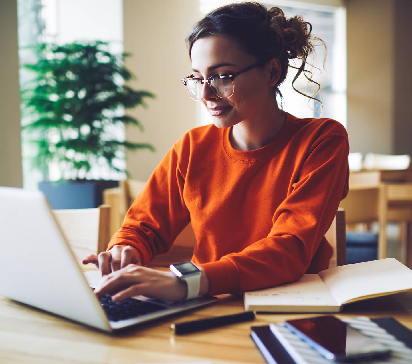 Professional content editor typing in a wireless laptop