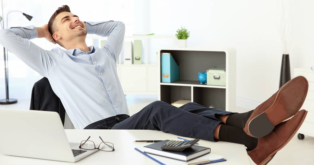 Young man resting from work at desk