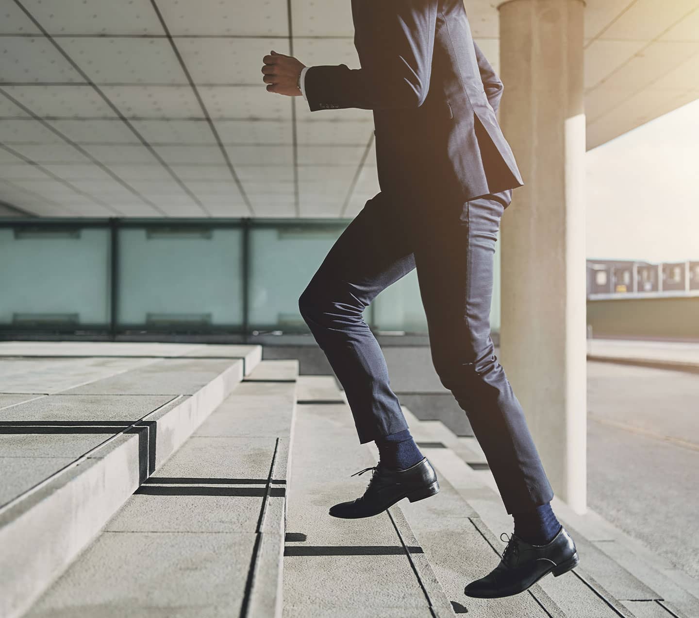 Business man going up the stairs representing upgrade