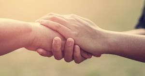 2 people holding hands