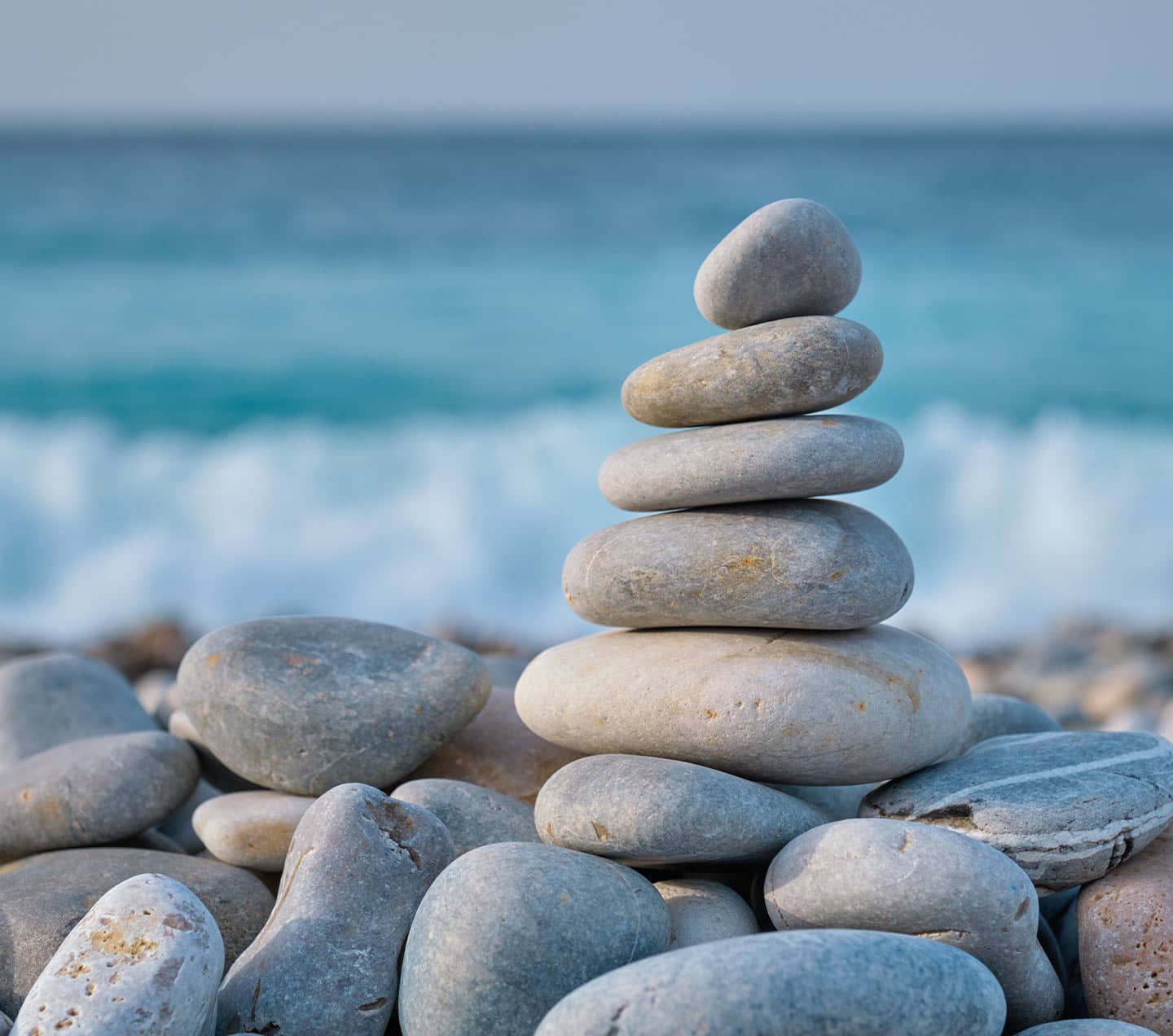 Balanced rocks on a beach representing stability
