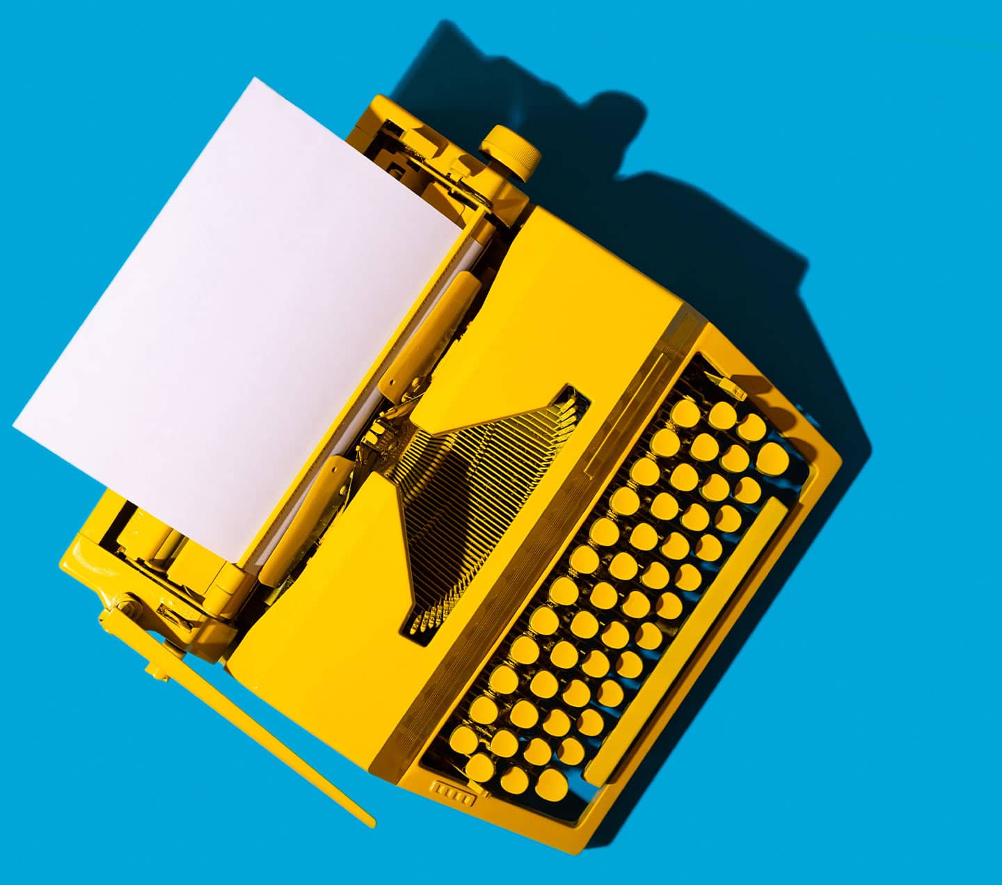 Yellow typewritter on blue background
