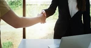 Business partners shaking hands