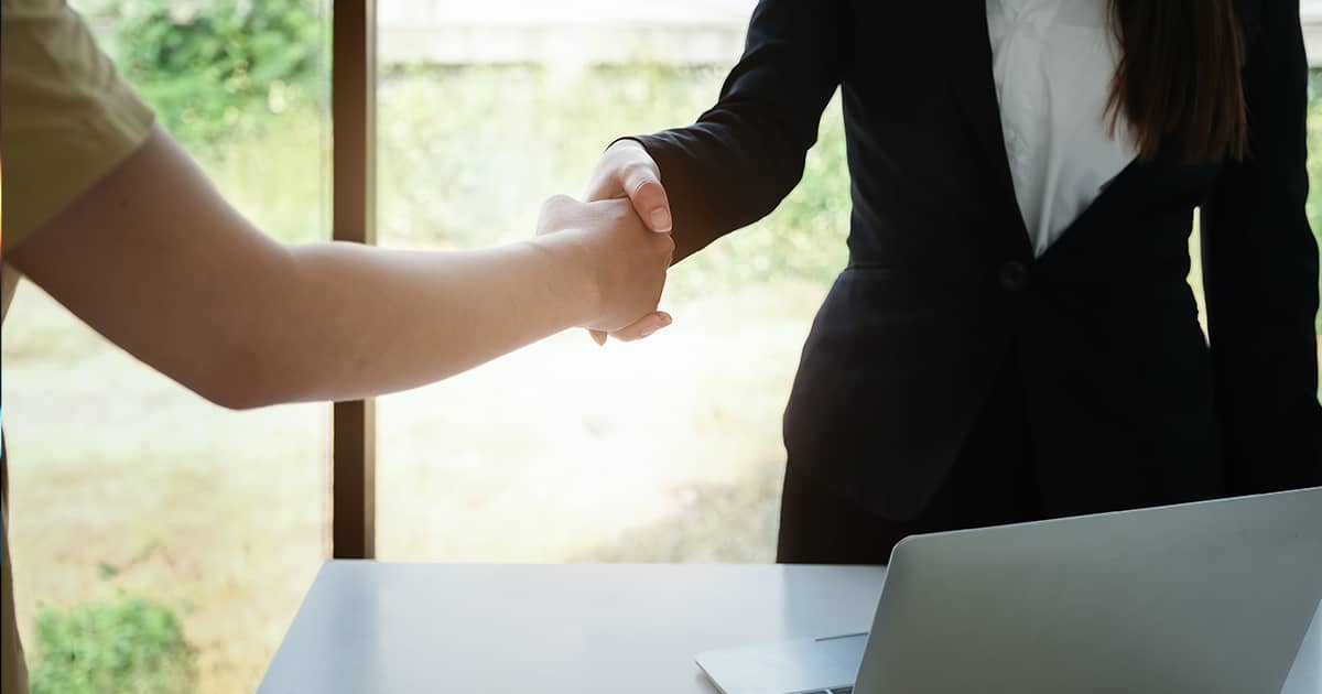 Business partners shaking hands