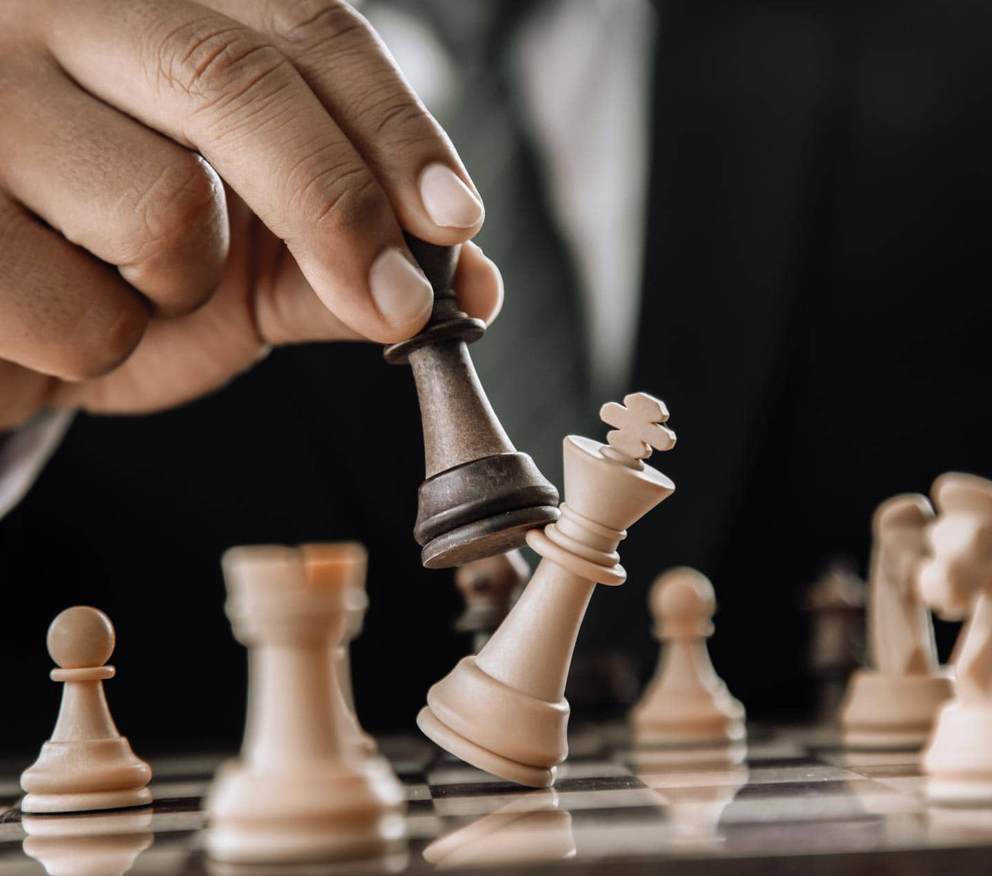 Hand moving chess figure