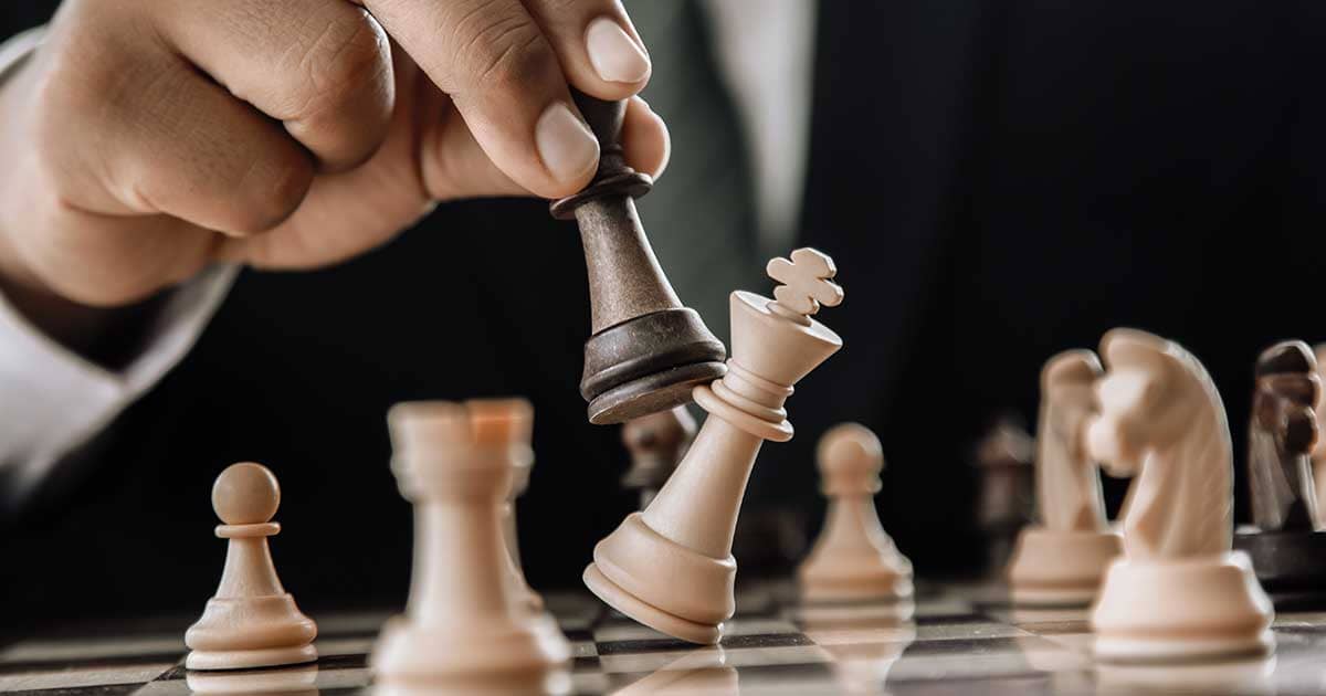 Hand moving chess figure