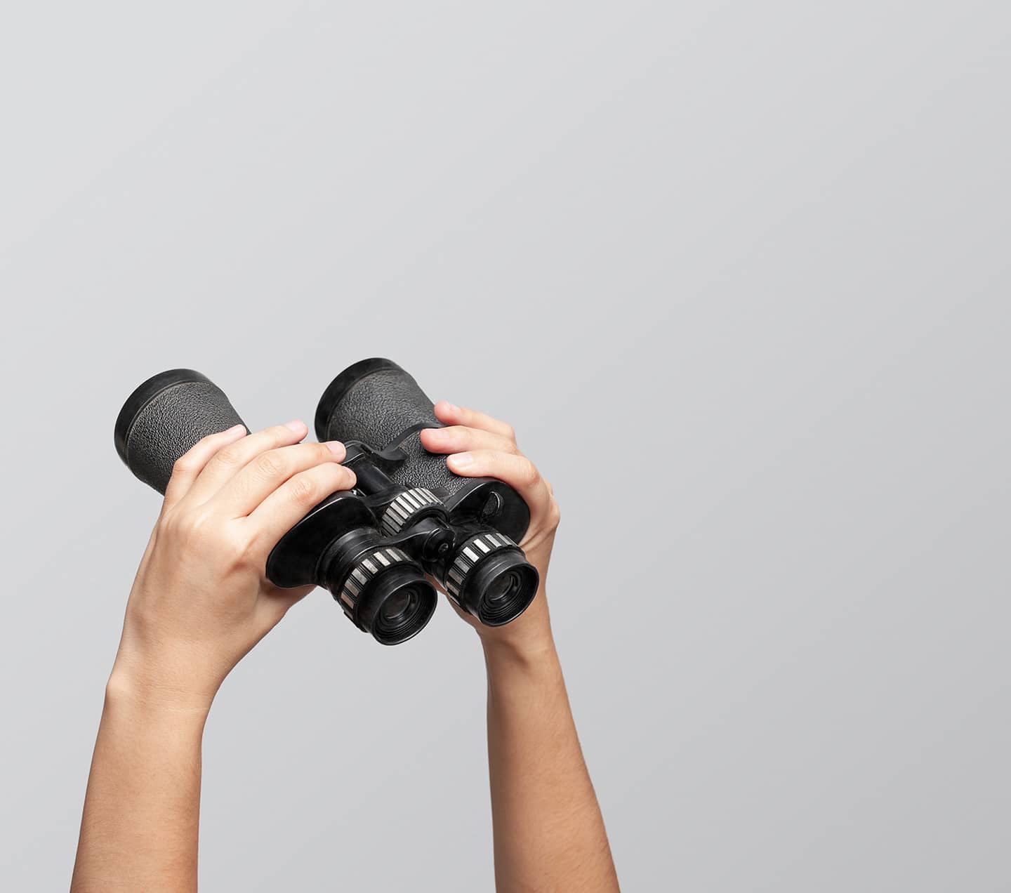 Hands holding binoculars