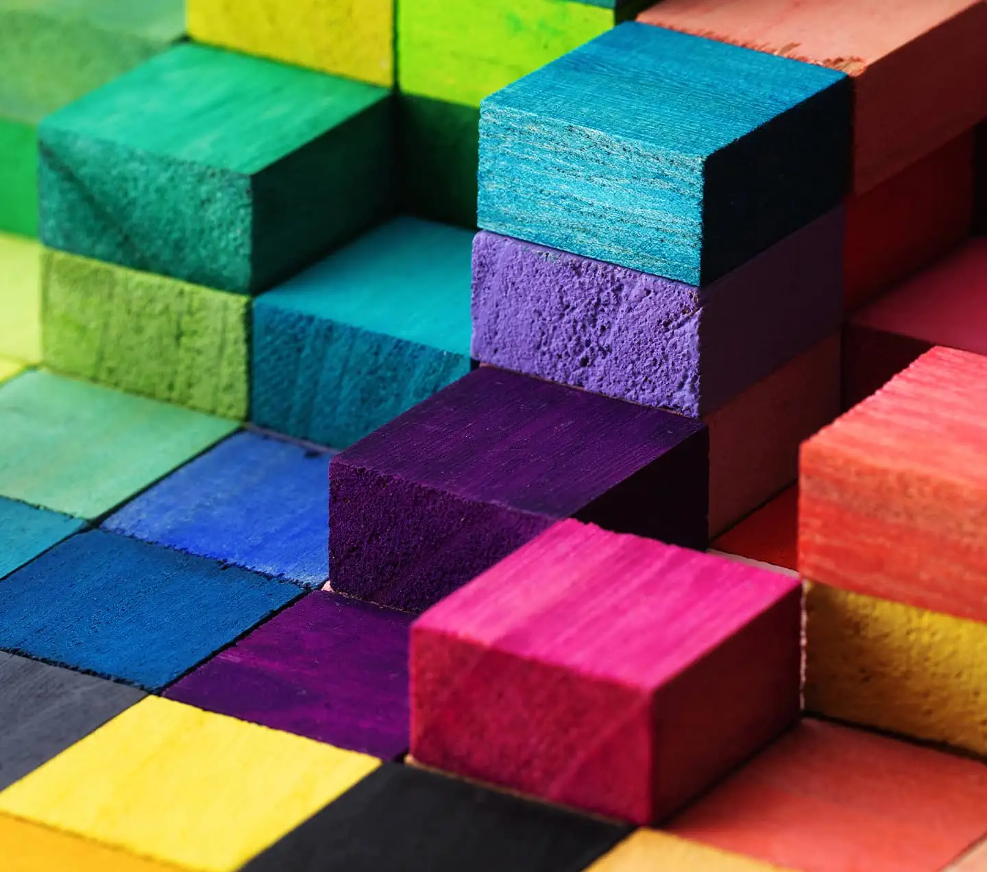 Spectrum of stacked multi-colored wooden blocks