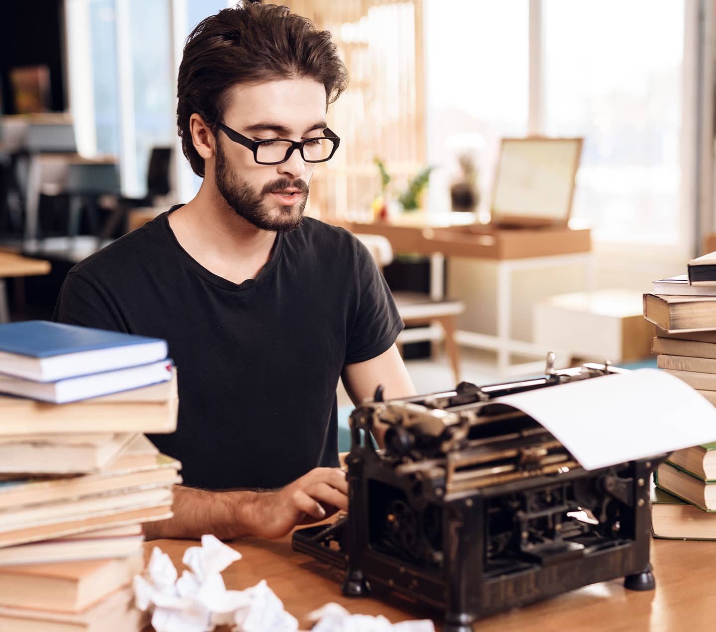 Man adding content to a typewriter
