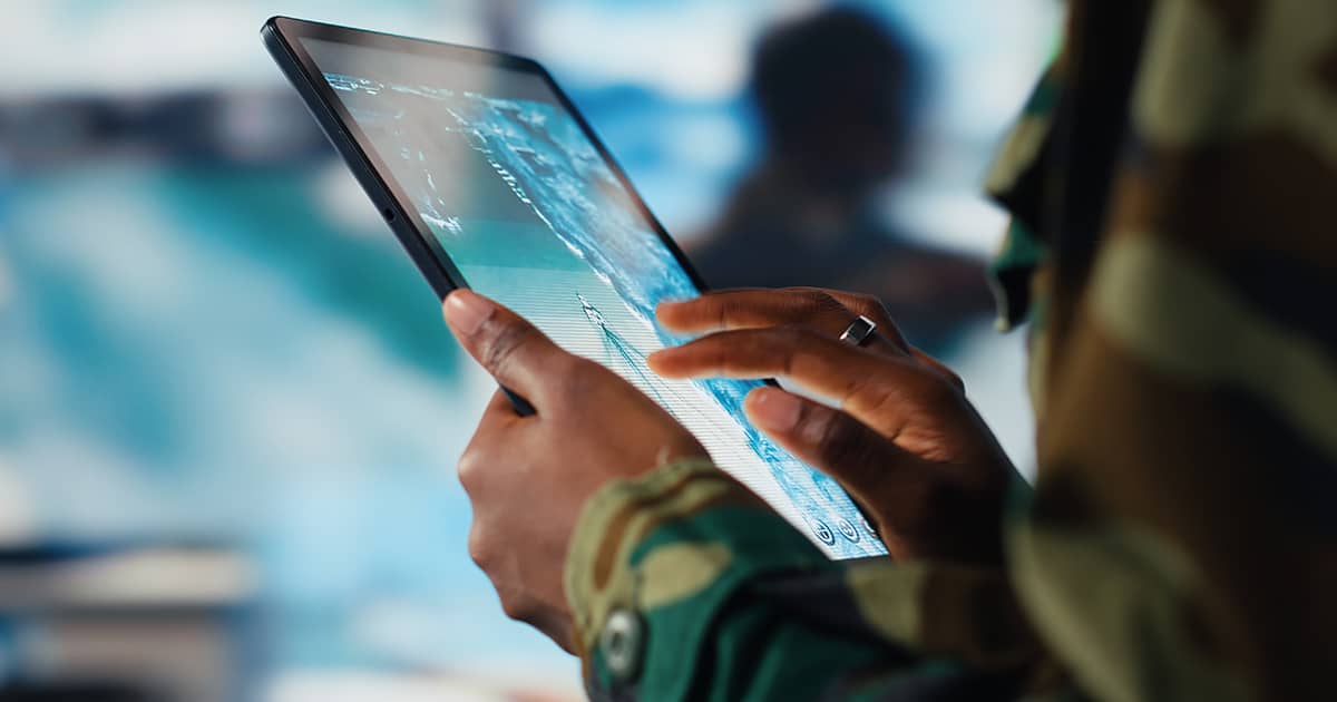 Woman's hands working on a tablet
