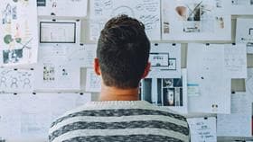 back of marketer looking at personalization strategy board