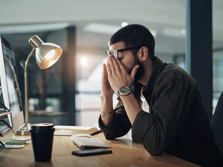 Man struggling in front of a computer